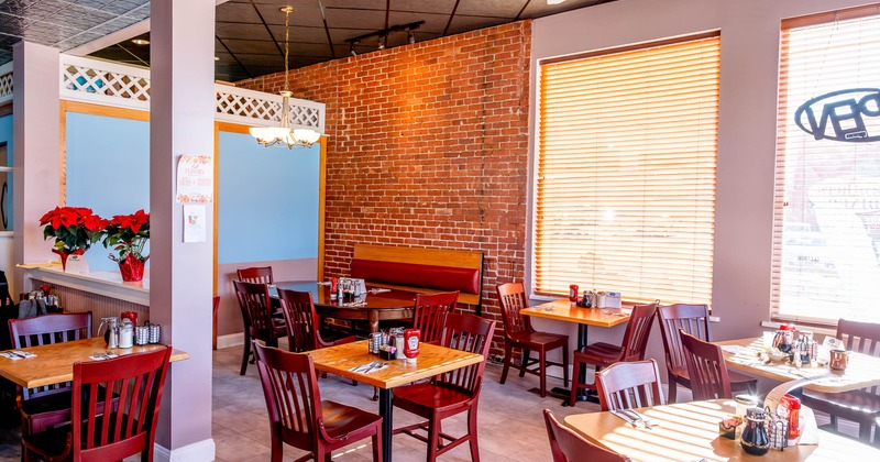 Interior, tables and chairs ready for guests
