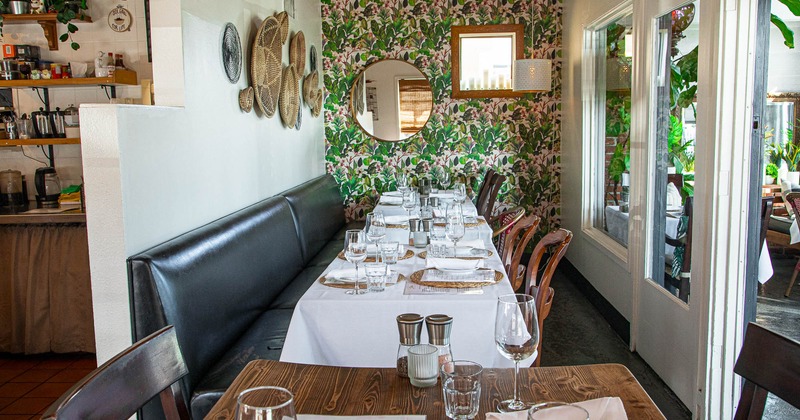 Interior, long table, booths and chairs, ready for guests