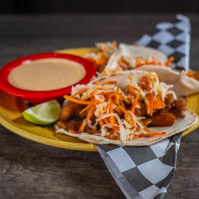 Fish tacos with chipotle crema on the side.