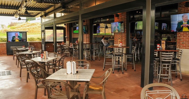 Interior, dining tables and seating, wall TV, seated guests