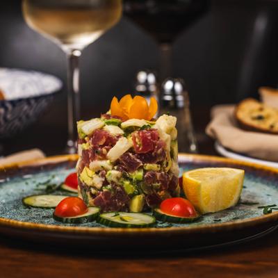 Tuna tartare with avocado, lemon, cherry tomatoes.