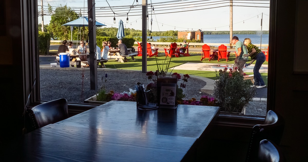 Interior, diner table by window, patio behind