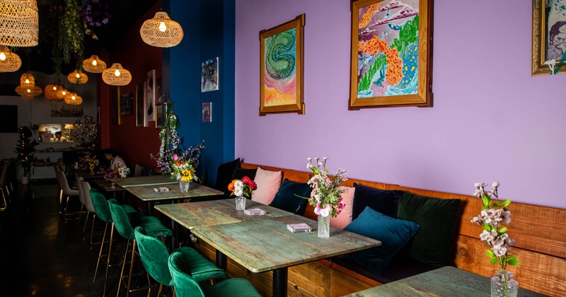 Interior, tables and green chairs lined up