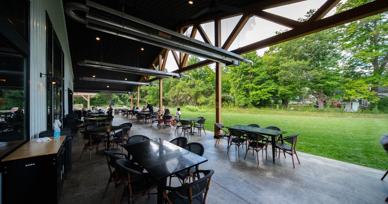 Exterior, terrace, tables chairs, lawn at the back