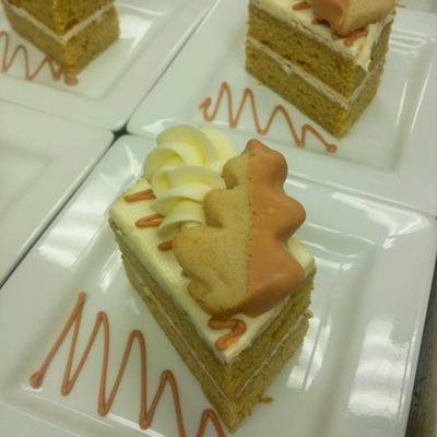 Multiple plates with cake slices on them.