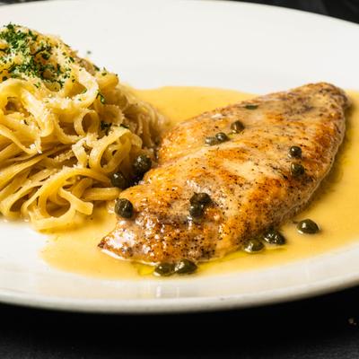 Chicken breast with in wine, lemons and capers, with butter sauce spaghetti.