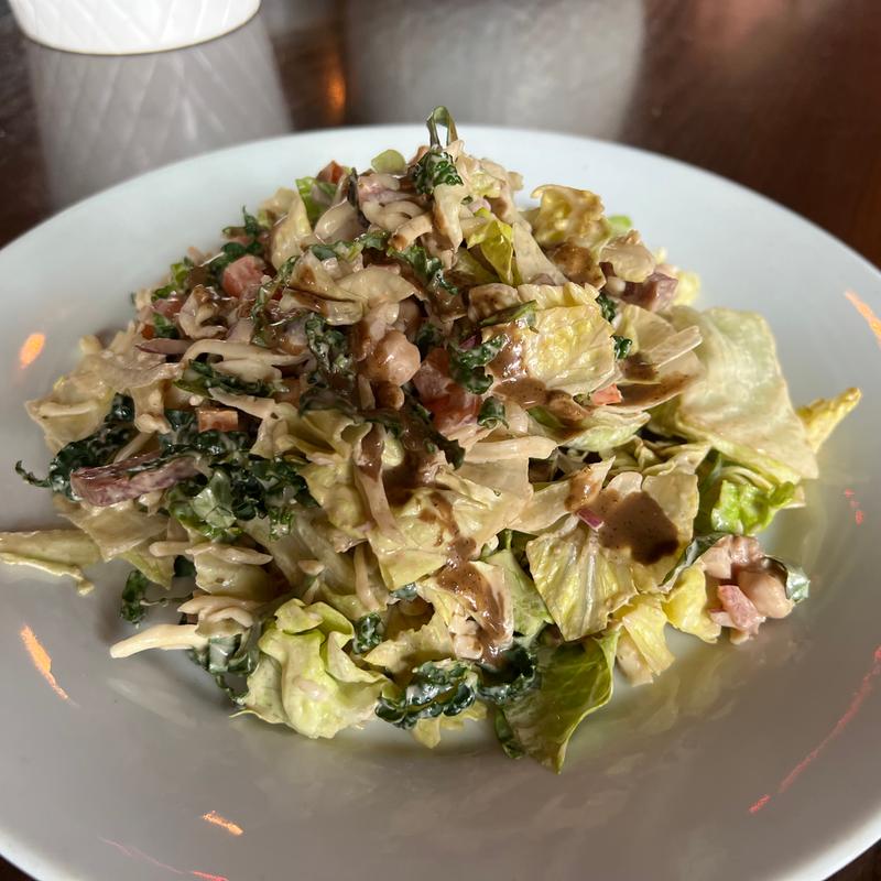 Chopped salami, provolone, garbanzo, tomato, red onions, iceberg, red leaf, small ribbons of kale, creamy tarragon vinaigrette* - GF photo