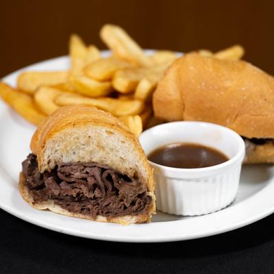 Beef Dip sandwich, served with au jus and fresh french fries..