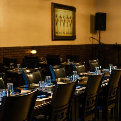 Restaurant dining area, fully set tables.