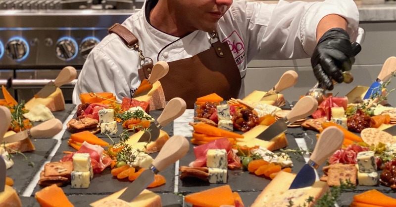 A person preparing and serving food