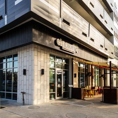 El Naranjo restaurant exterior with a modern facade and colorful outdoor seating area.