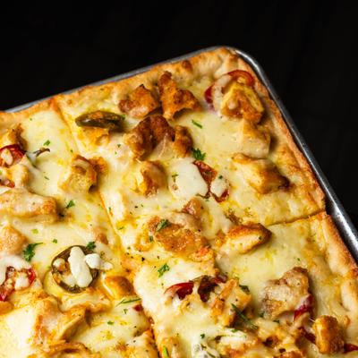 Chicken Bacon Ranch pizza, close-up view.