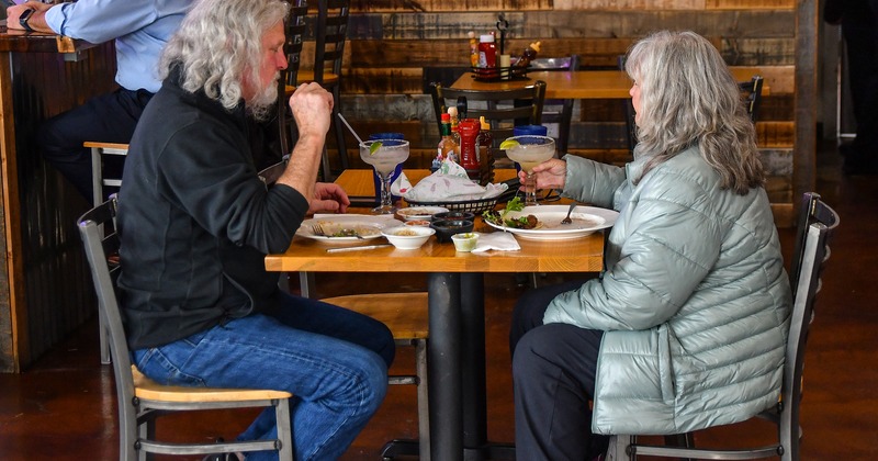 Interior, diner table for two, guests eating