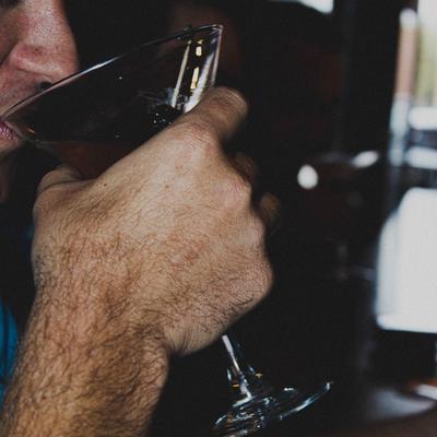 Customer drinking a cocktail.