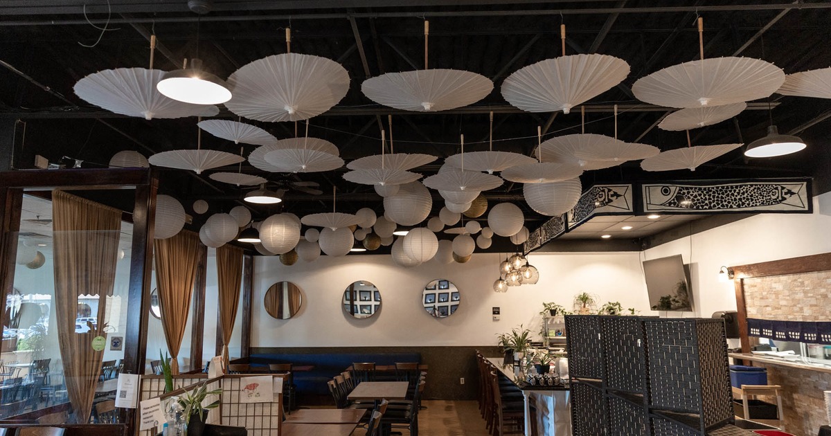 Interior, dining area, white upside down umbrellas on the ceiling