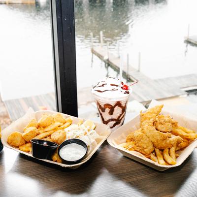 Fried Scallops with fries, sauces, and coleslaw, Chicken tenders and fries, milkshake.
