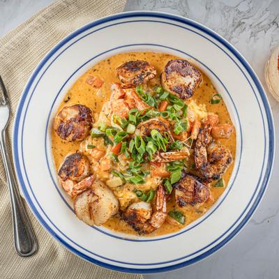 Blackened scallops and shrimp in Cajun cream sauce.