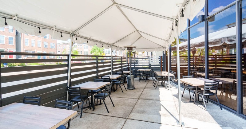 Exterior, patio covered with awning, tables and chairs