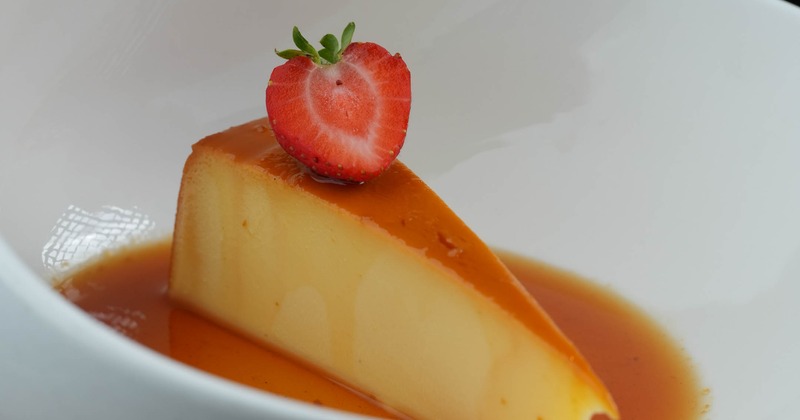 Basque Cheesecake garnished with a strawberry