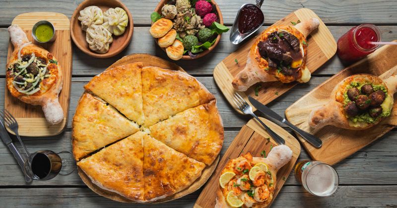 Assorted dishes and drinks on a wooden table