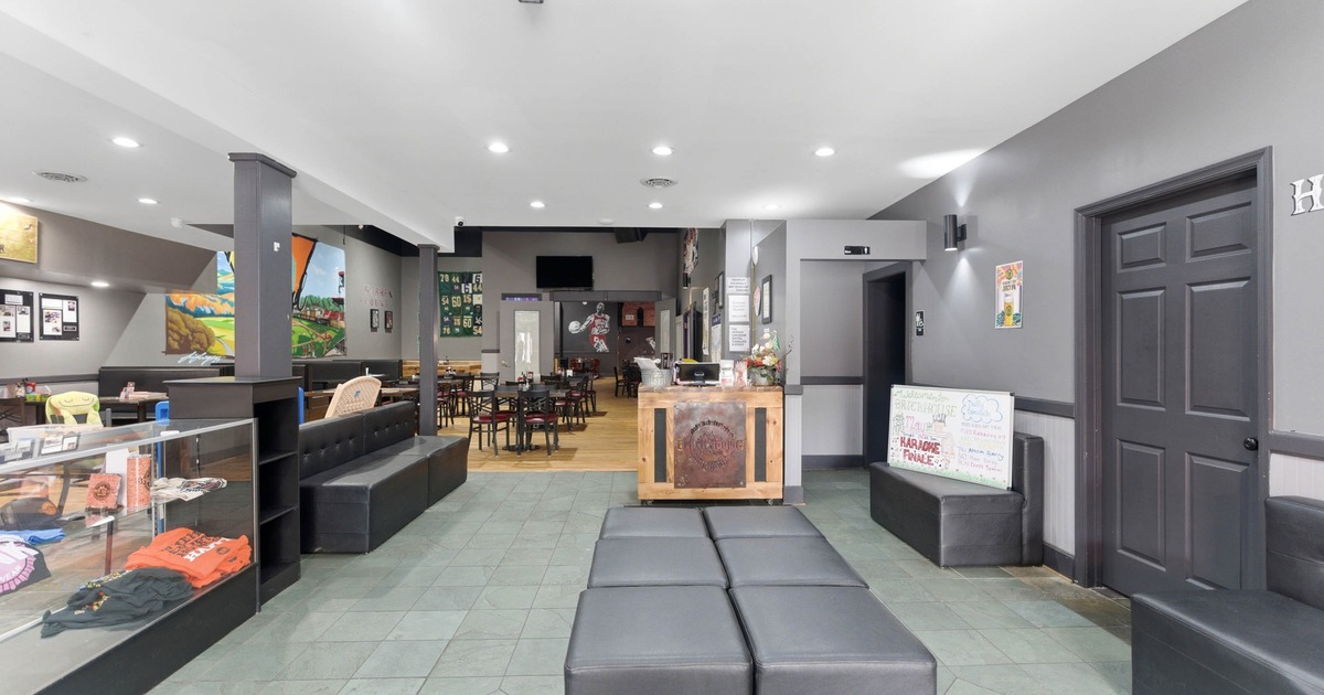 Game room, seating area, pool table, dartboards