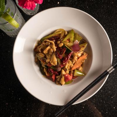 Kung pow chicken, served with a drink.