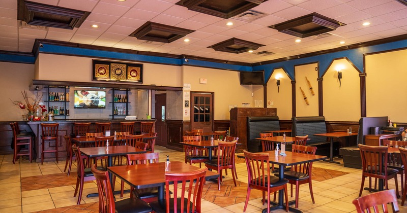 Interior seating area with tabled, chairs and booths