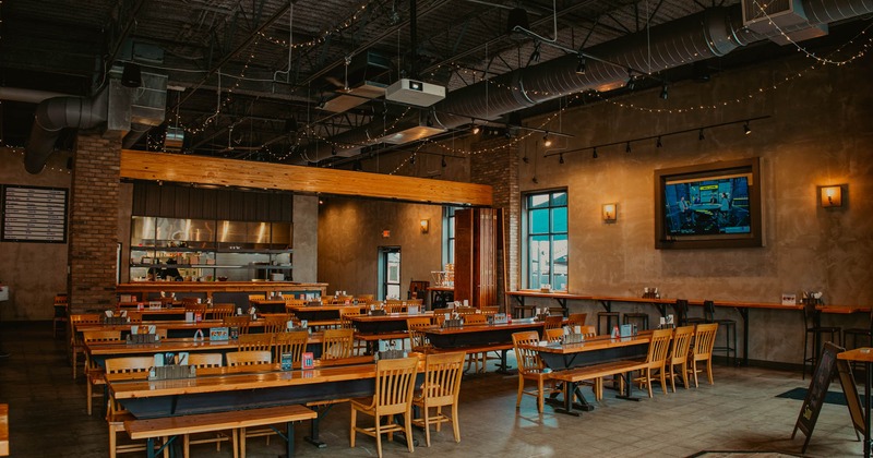Interior, dining area, TV on the wall