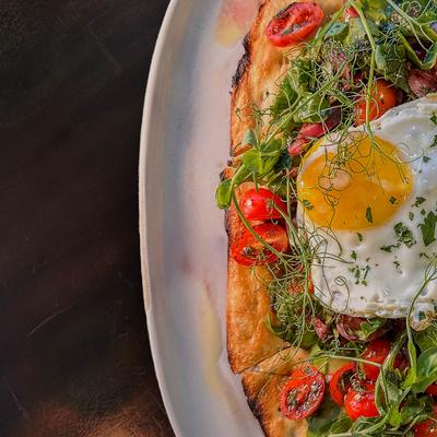 Breakfast flatbread, top view close up.