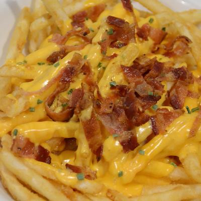 French Fries with Bacon and Cheese Sauce.