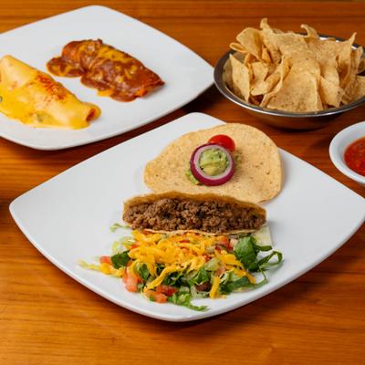 Taco, tostada, enchiladas, nachos and dip served with Margarita cocktail.