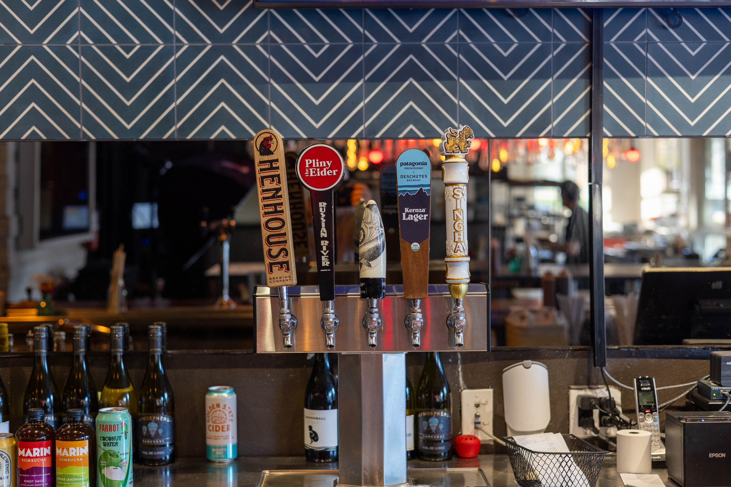 Multiple beer taps behind the bar