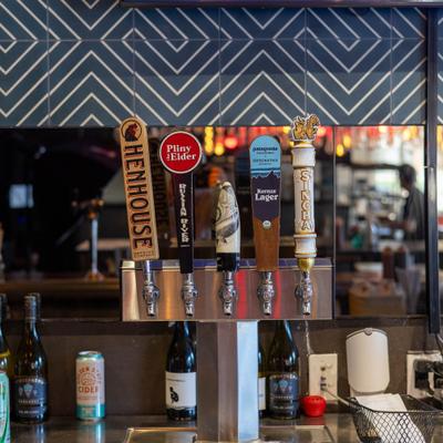 Multiple beer taps behind the bar.