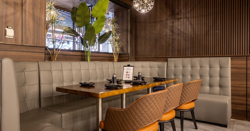 Dining table in the corner set for six guests