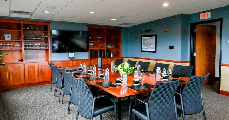 Interior, table ready for guests, detail, TV on the wall