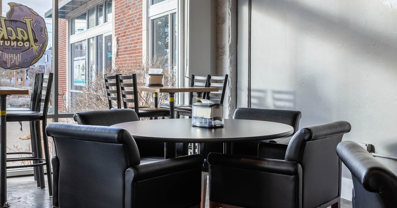 Interior, round table and leather armchairs