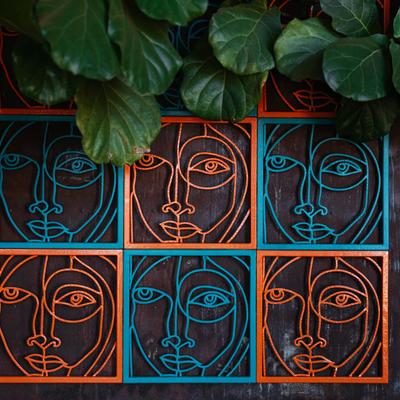 Interior, a wall decorated with wrought iron art.