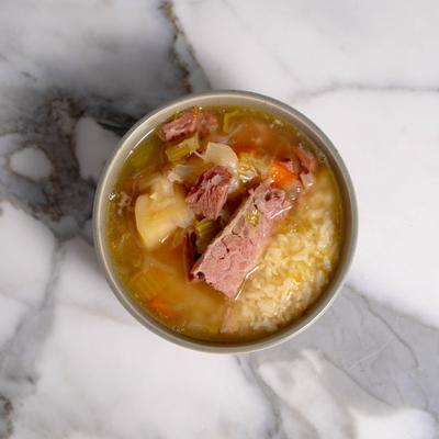 Corned beef soup with rice and vegetables.