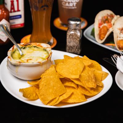 Spinach Artichoke Dip, with tortilla chips.