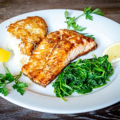 Grilled salmon, with mashed potatoes, and sauteed spinach.