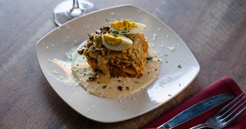 Lasagna with creamy sauce and boiled egg