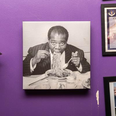 Wall Decor, a picture of Louis Armstrong eating spaghetti.