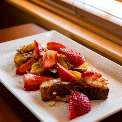 French toast topped with sliced strawberries