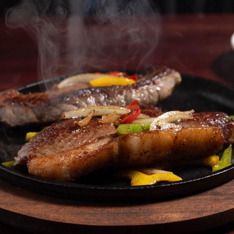 menu item 10 of 12, Sizzling Top Sirloin Steak with Onions