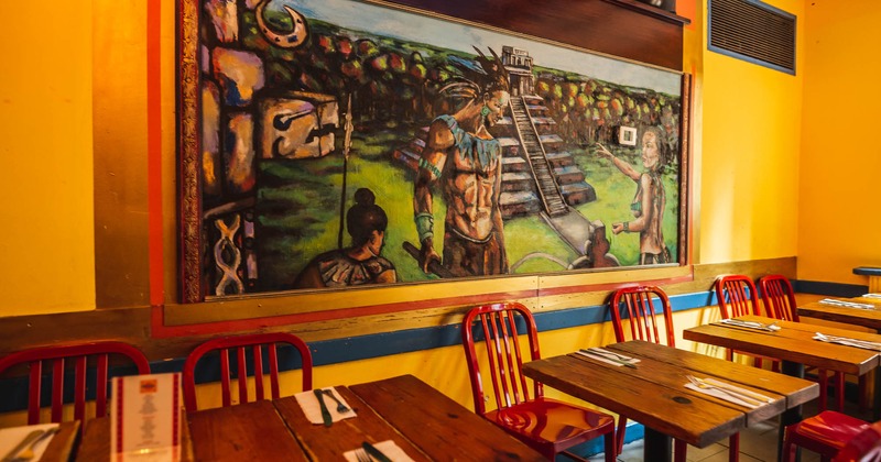 Dining room tables and a mural