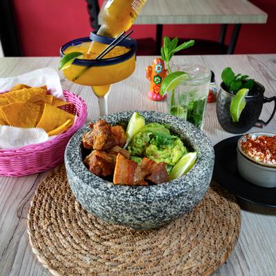 Guacamole with crispy pork belly.