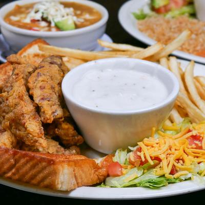 Fried chicken tenders with fries, toast, and ranch dip.