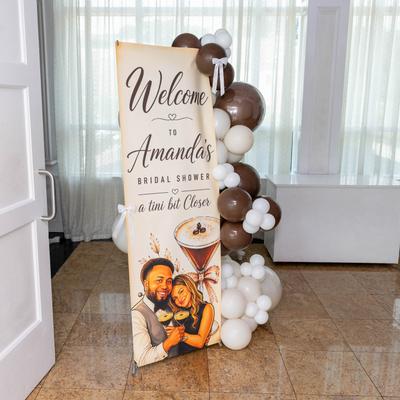 Welcome sign with balloons.