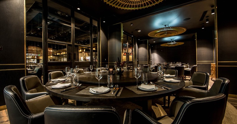 Interior, round table fully set for guests