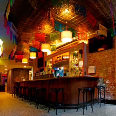 Interior, seating area, bar counter and chairs.